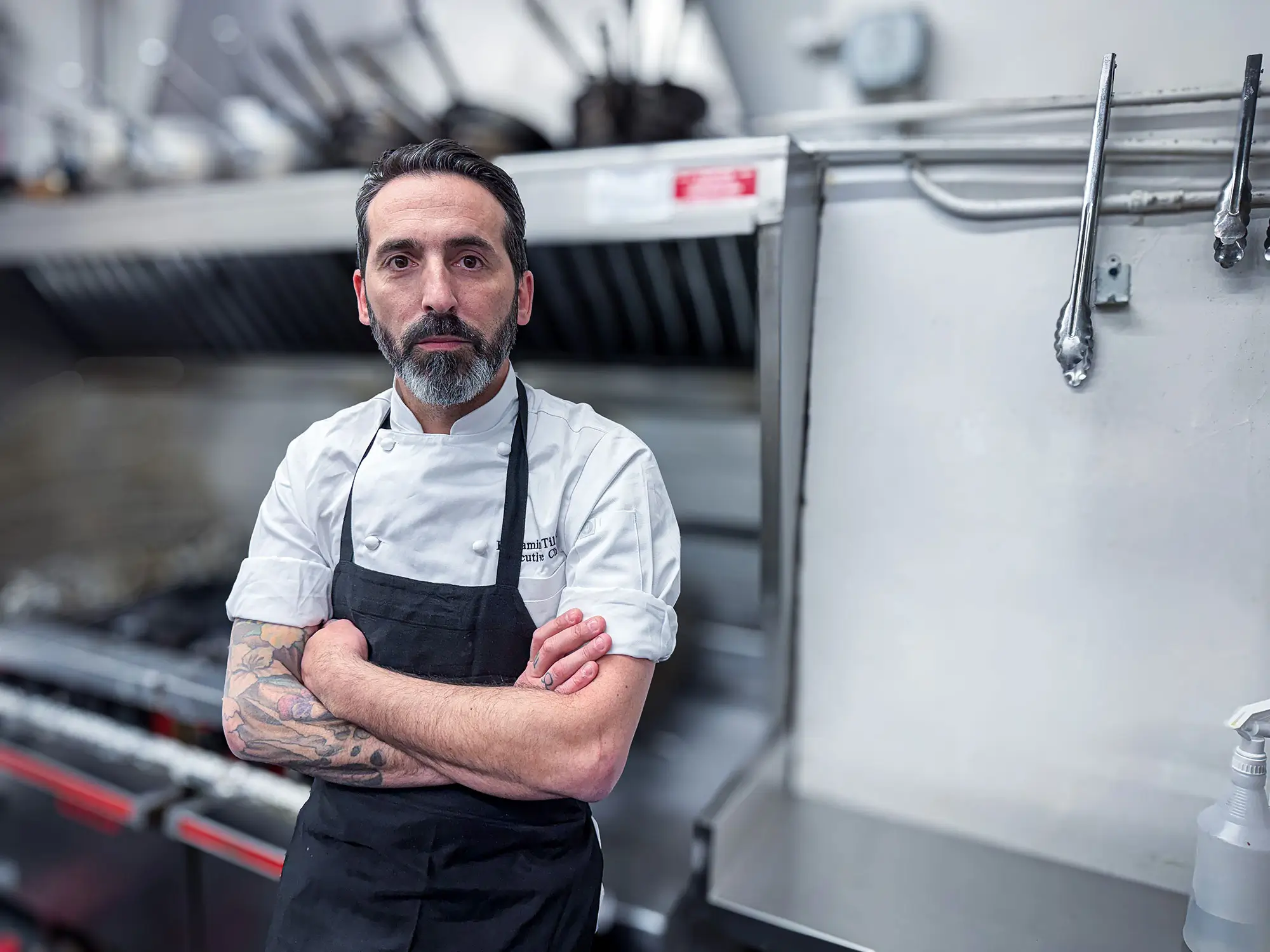 Portrait of Chef Benjamin Tilatti in the kitchen, multi-unit chef for Rule Prime, Pasta, and Vintage House in Hickory, NC